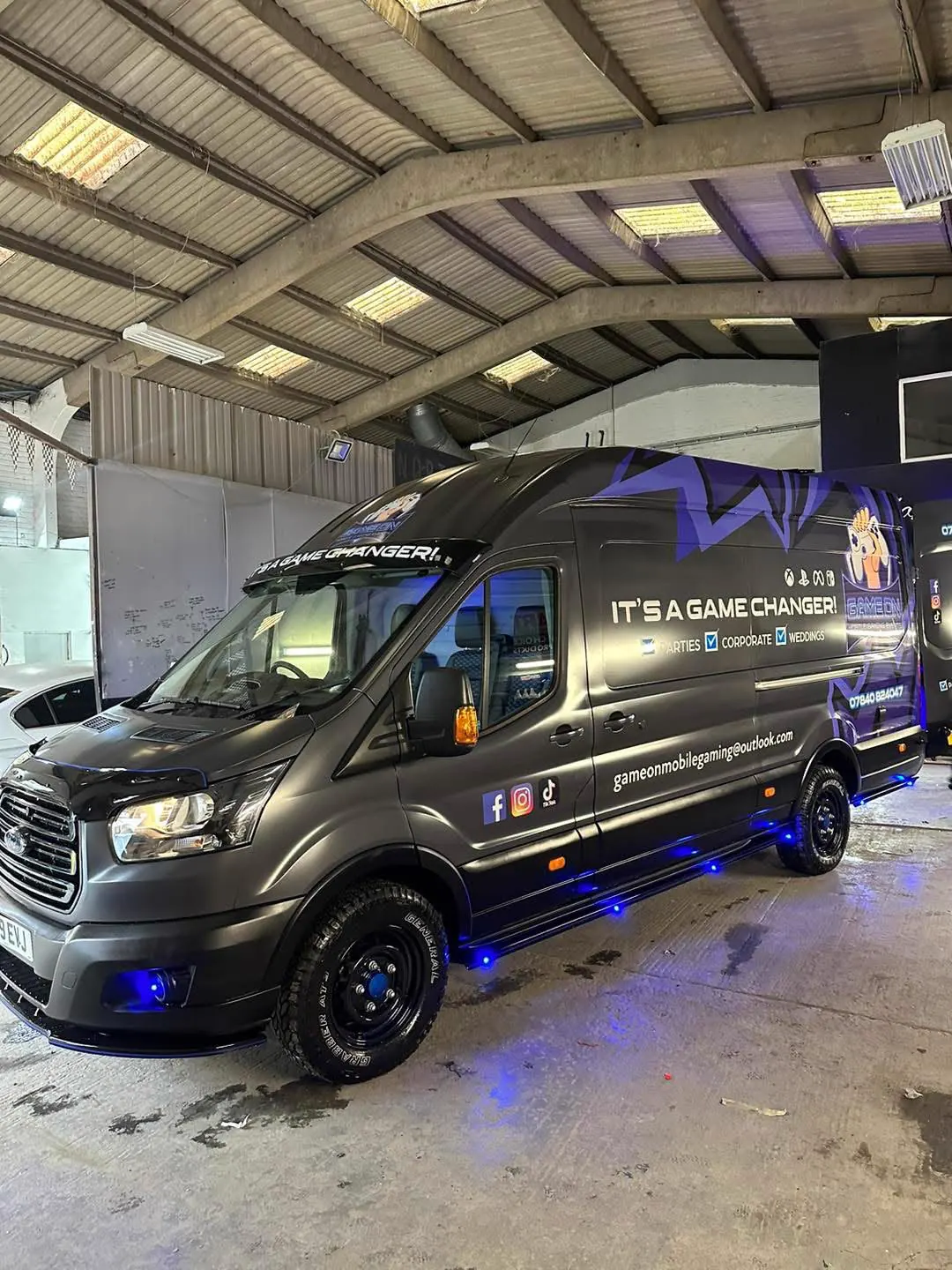 Completed mobile gaming van conversion with custom graphics